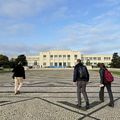 The main building of Instituto Superior Técnico and the Aalto Online Learning - Online Hybrid Lab team walking towards it